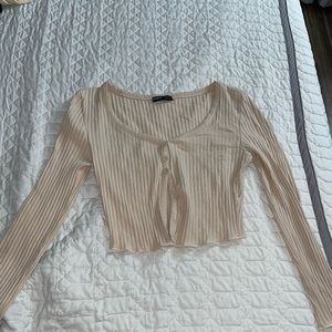 Long sleeve button down crop top.